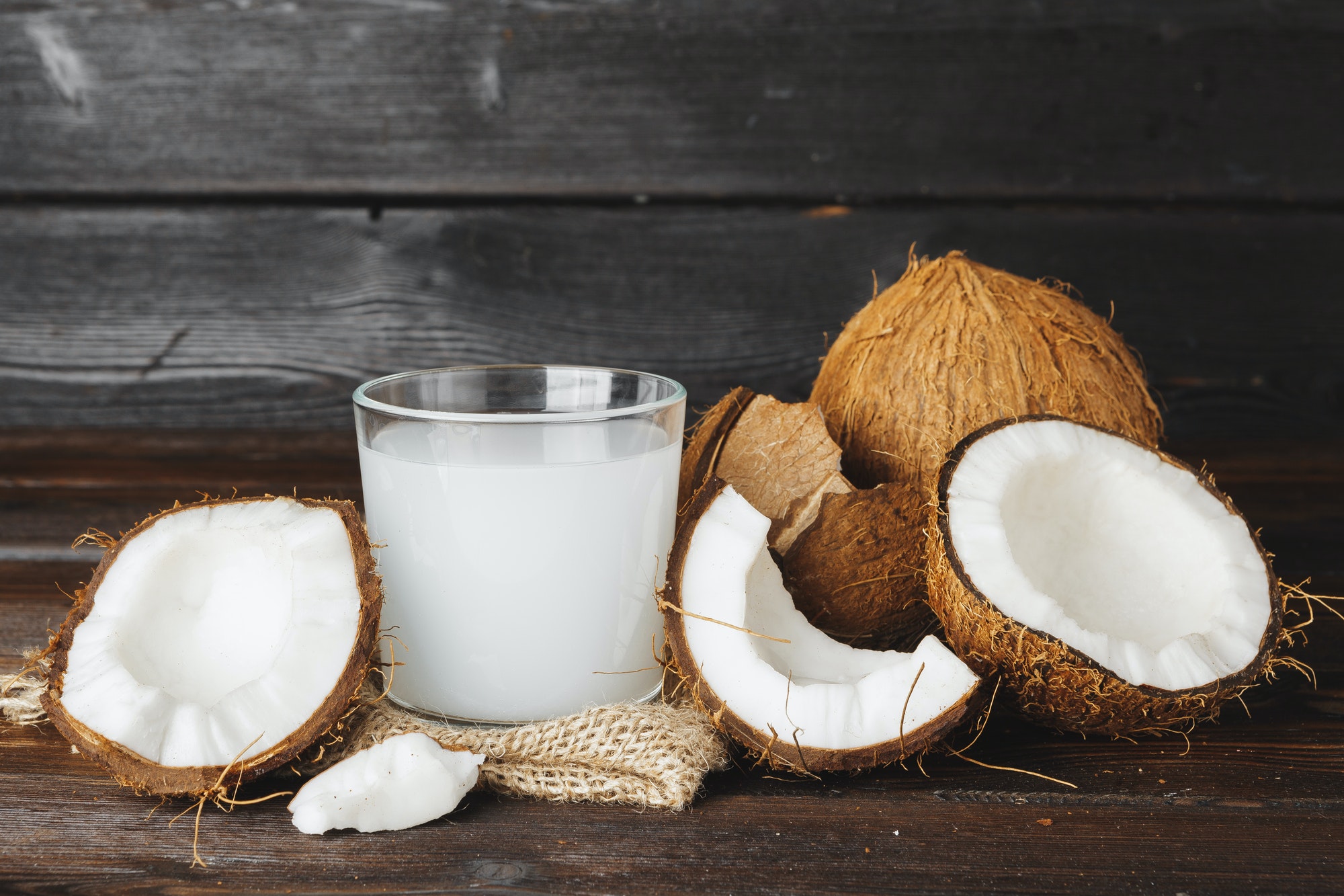 Coconut and glass jug with coconut milk